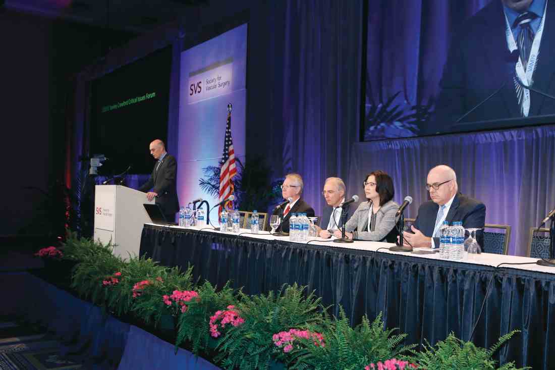 Dr. Kim Hodgson (podium) kicks off the E. Stanley Crawford Critical Issues Forum Thursday at VAM. Also participating, from left, are Drs. Fred Weaver, Anton Sidawy, Arlene Seid and Larry Kraiss.