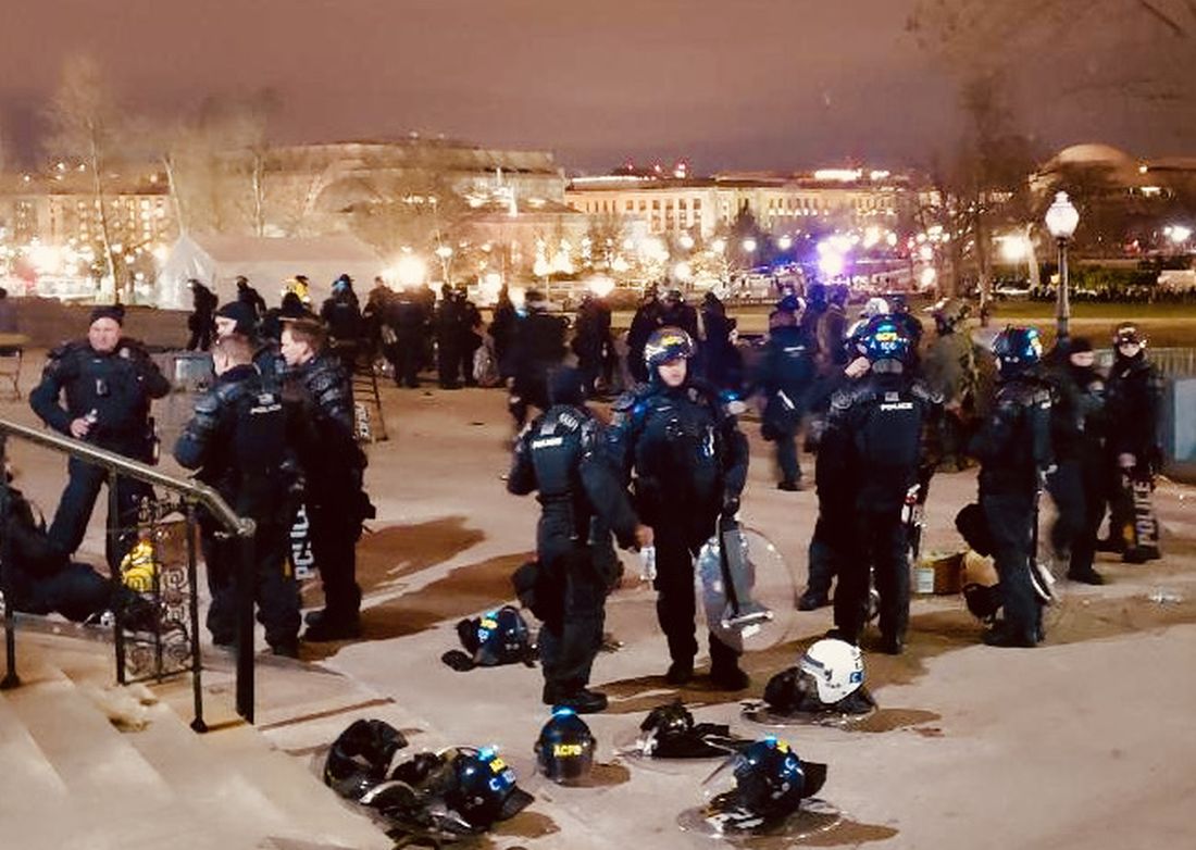 Officers gather on the Capitol grounds in the wake of the Jan. 6 insurrection. The repercussions of that day are still being felt.