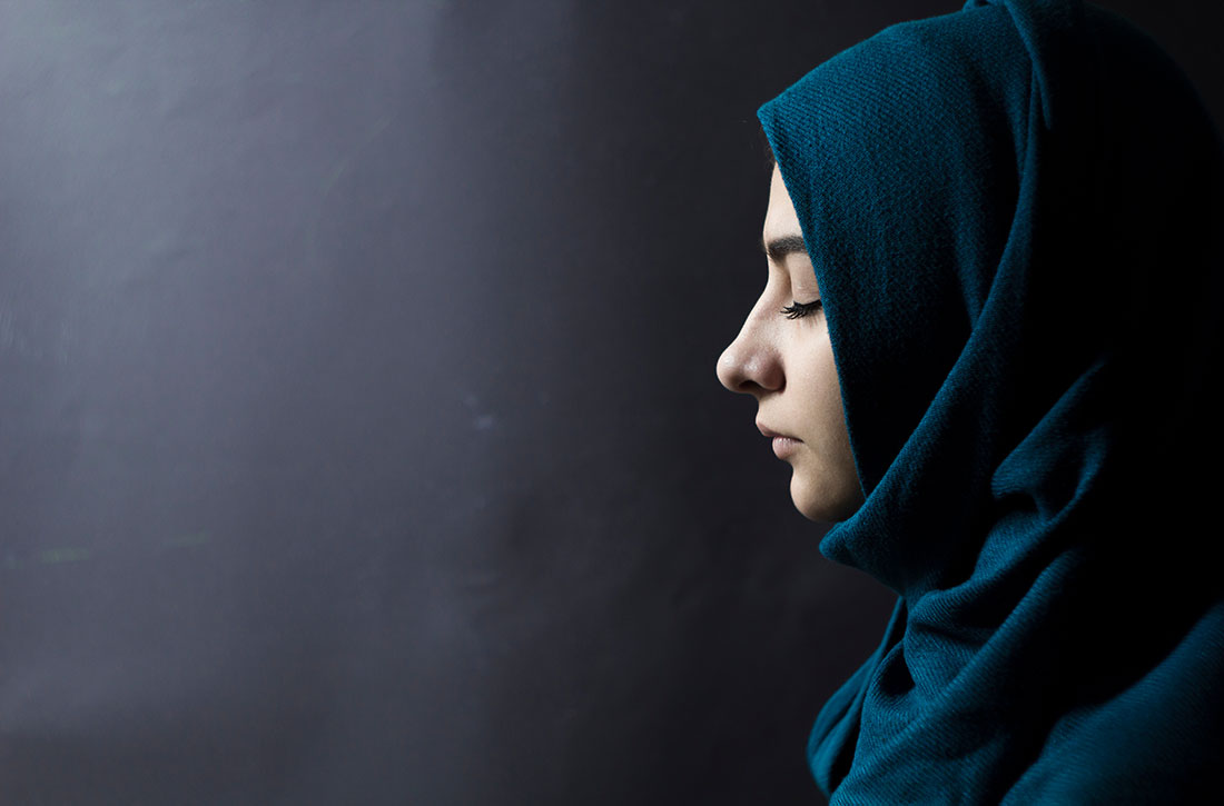 American Muslim woman with her eyes closed