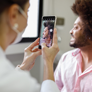 Doctor taking photo of patient