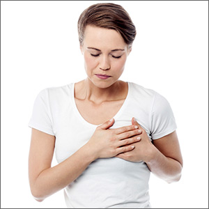 Woman clutching breast in pain