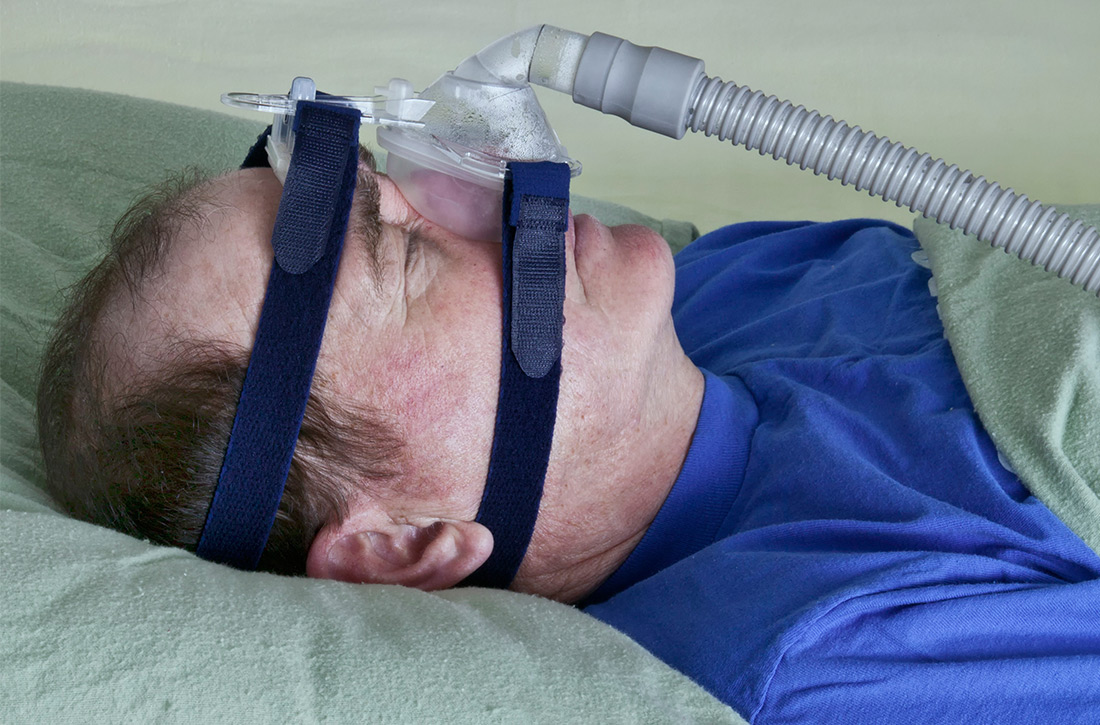 Man using CPAP machine