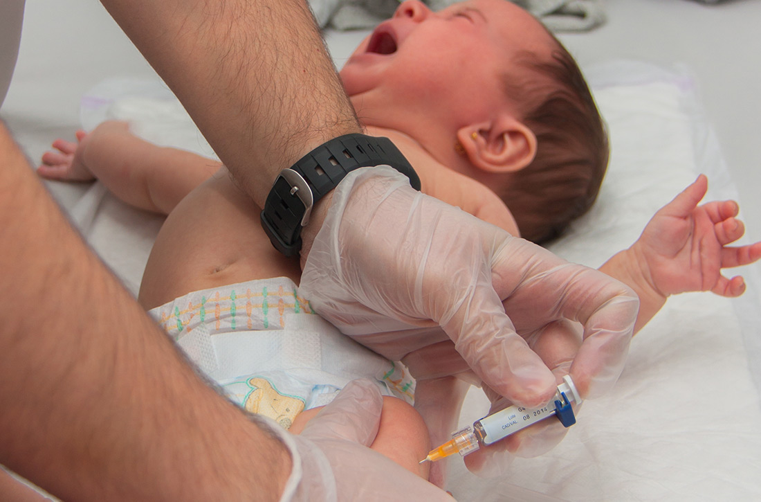 Giving vaccine to baby