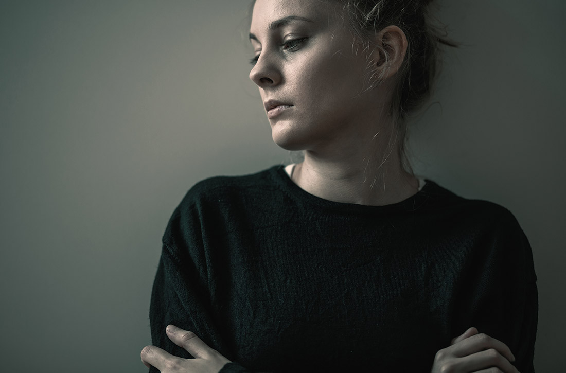 Woman standing against wall