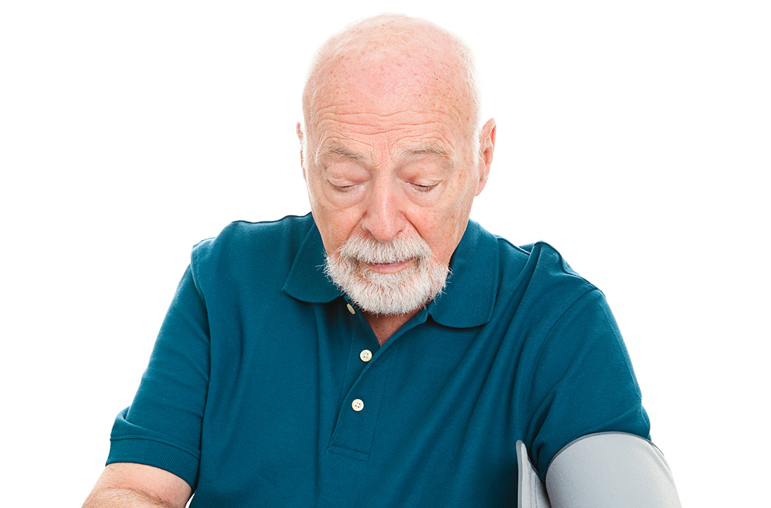 Old man getting blood pressure checked