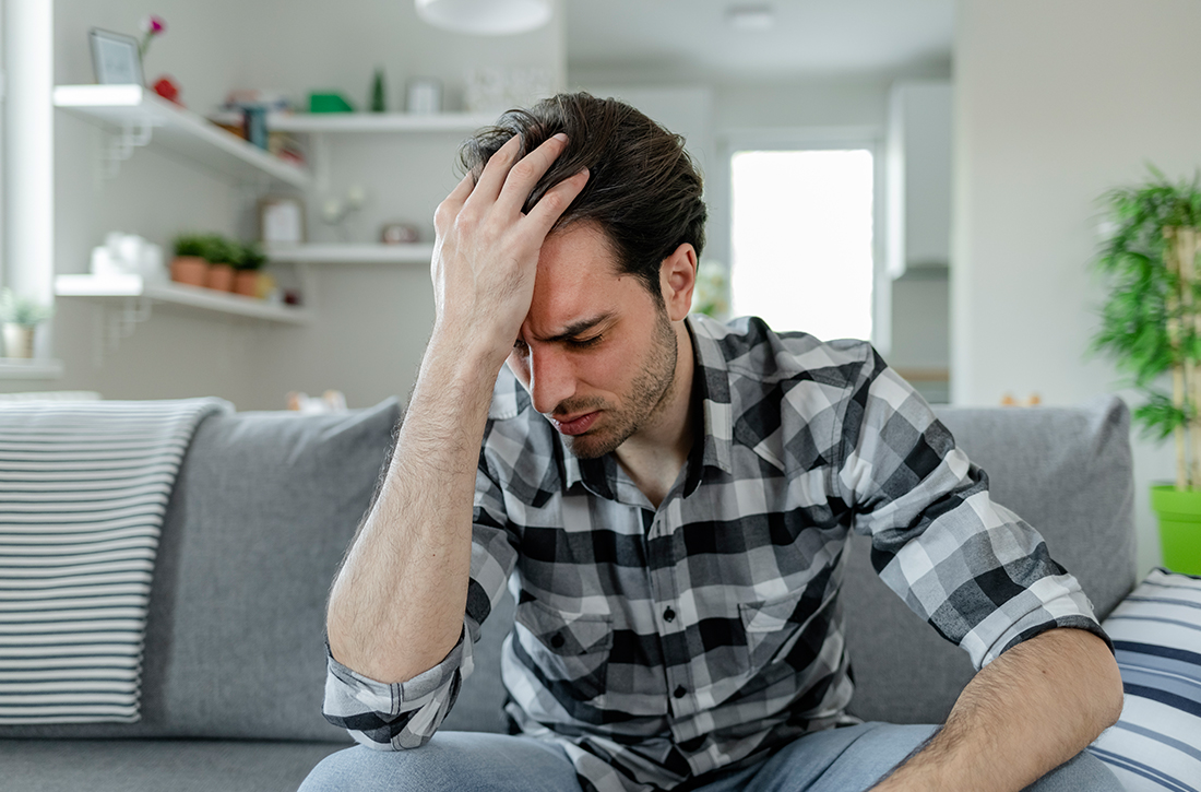 Man holding his head 