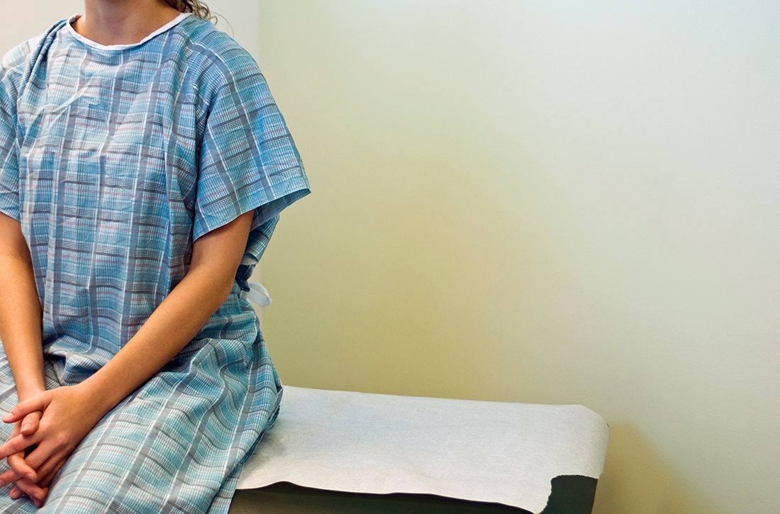 Patient sitting on exam table