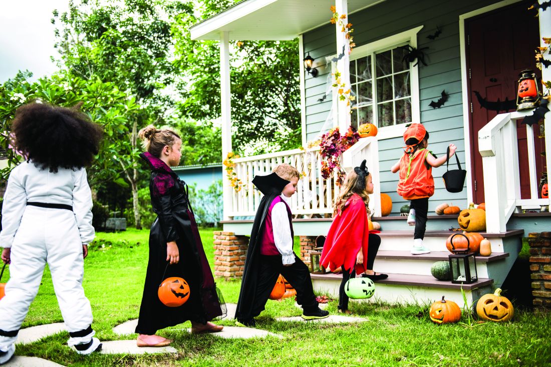 Children approach a door for trick or treating