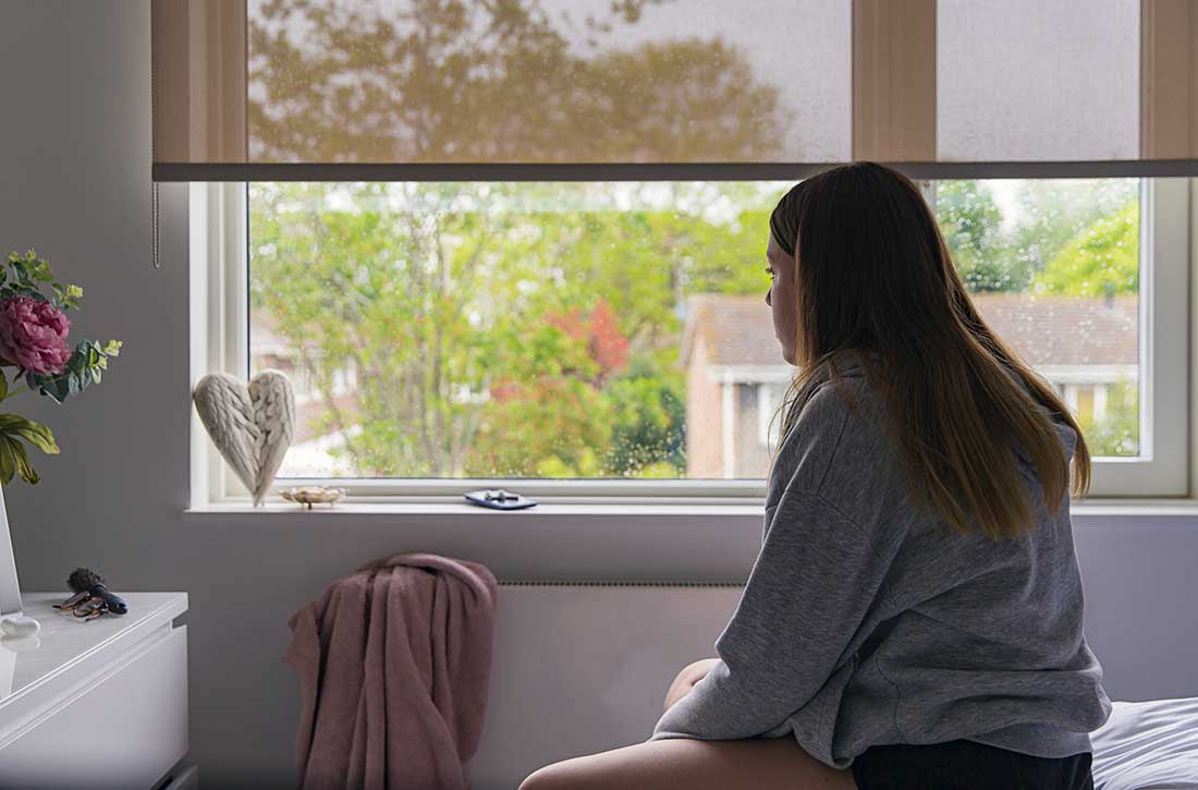 Child sitting on bed