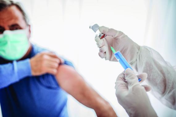 man receiving COVID-19 vaccine