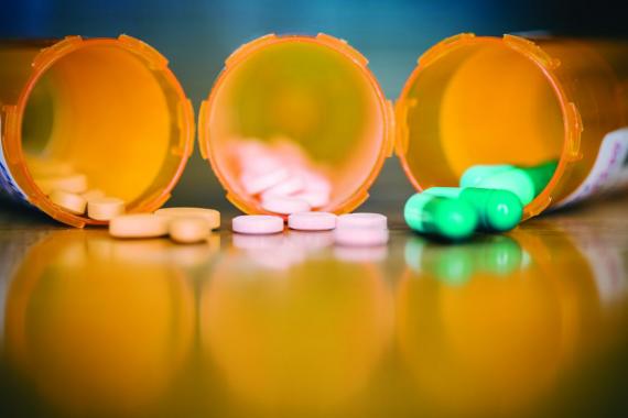 opioid pills in pill bottles 
