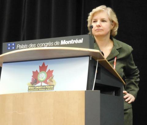 Dr. Karen F. Murray speaking from the podium at the World Congress of Pediatric Gastroenterology, Hepatology, and Nutrition