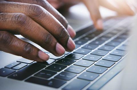 Typing on laptop