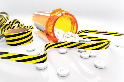 Pills spilling out of pill bottle
