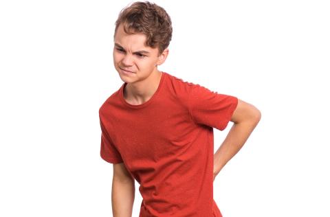 Child holding back in pain