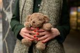 Woman holding teddy bear