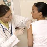 Doctor giving patient flu shot