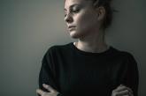 Woman standing against wall