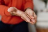 Holding fingers in hand Holding fingers in hand