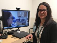 Dr. Elizabeth Ferucci, a rheumatologist for the Alaska Native Tribal Health Consortium, sits near her two-way telemedicine screen. Dr. Ferucci uses tele-rheumatology for follow-up visits with patients in rural and remote areas in Alaska.