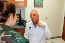 Dr. Norman B. Gaylis discusses VNS device placement with a patient.