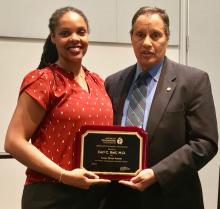 Dr. Carl C. Bell displays the APA's Adolph Meyer Award for Lifetime Achievement in Psychiatric Research with Dr. Glenda Wrenn of Atlanta.