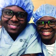 Michael St. Jean (left) and Schneider Dorcela recharge after observing an interventional cardiology procedure.