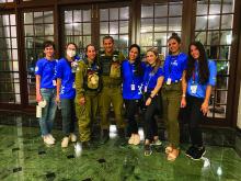 Members of CADENA’s disaster response team share a moment with Israeli Defense Forces search and rescue team members. The CADENA team members provided Psychological First Aid to the Surfside, Fla., community.