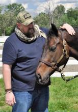 Veteran Matthew Rypa with Crafty, an equine therapy horse in the Man O'War Project.