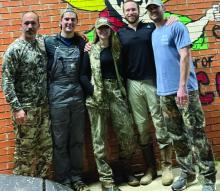 From left, Dr. Adam Byrd, Dr. Joshua Ortego, Dr. Hannah Badon, Dr. Ross Pearlman, and Dr. Badon's husband, Justin, strike a pose at a local restaurant after some ATV riding on Dr. Byrd's farm in Louisville, Miss.