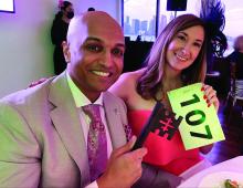 CHEST member Bravein Amalakuhan, MD, FCCP, and his wife, Megan Cool Amalakuhan, show off their winning raffle number.