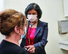 Dr. Vaidehi R. Chowdhary, cofounder of the cardio-rheumatology program at Yale University, listens to a patient's heart.