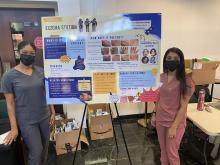 An image-rich poster is among the learning materials used to teach participants at the GW teledermatology clinic about atopic dermatitis, with help from medical students.