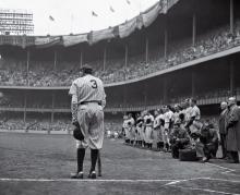 Babe Ruth leans on his bat during his final appearance at Yankee Stadium on June 13, 1948.