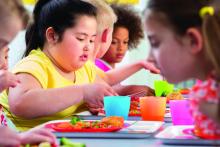 Overweight child eating lunch