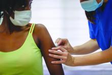 African-American female receiving a COVID-19 vaccine
