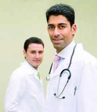 Portrait of leading doctor with assistant in the background