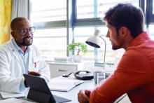 Doctor talking with male patient