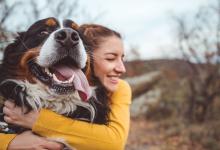 woman hugging dog