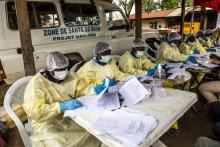 Health workers in the DRC earlier this year filled out forms before vaccinating people who'd been in contact with someone diagnosed with Ebola.