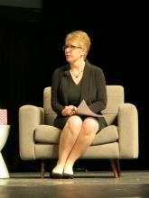 Dr. Kate Goodrich sits in an armchair during a keynote discussionon value-based care at the HIMSS17 meeting.