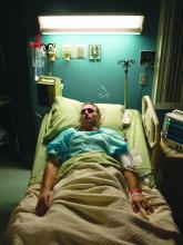 A patient sleeps in a hospital bed