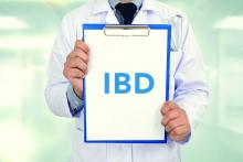 A doctor holds a sign that says IBD.