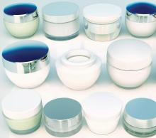 Lines of jars of skin care products. The view from the top.