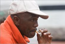 A man smokes a cigarette