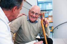 Doctor talking to an elderly patient.