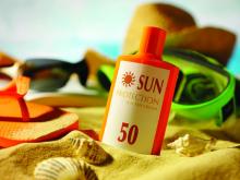 sunscreen bottle on beach