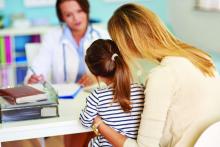 Mother and child with a pediatrician