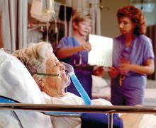 Elderly woman in hospital bed