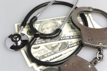 Handcuffs, a stethoscope, and paper money